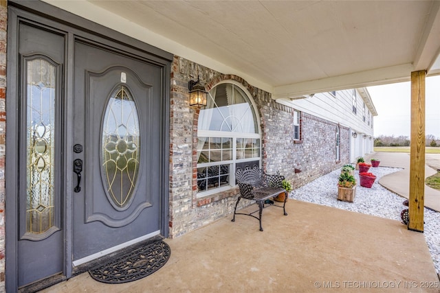 1522 Burney Cemetary, Calera, OK 74730 - doorway to property featuring brick siding
