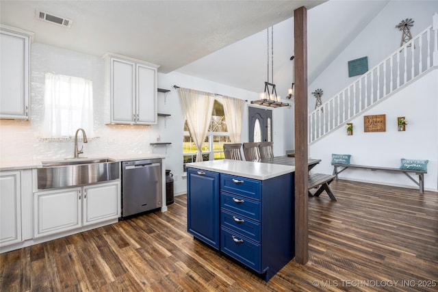 1522 Burney Cemetary, Calera, OK 74730 - kitchen with white cabinetry, lofted ceiling, blue cabinets, stainless steel dishwasher, and visible vents