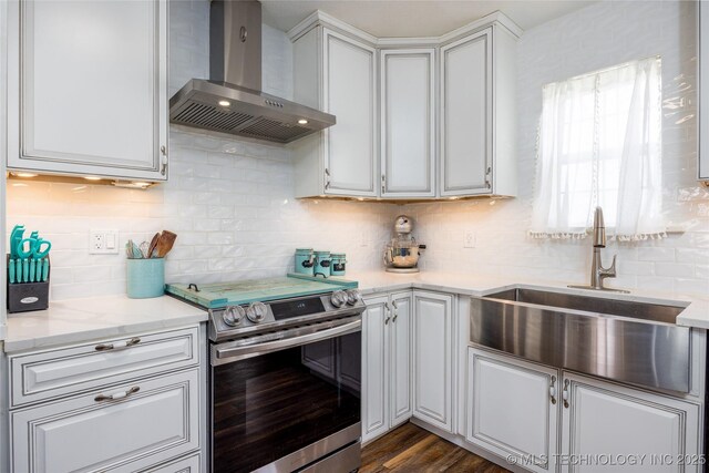 1522 Burney Cemetary, Calera, OK 74730 - kitchen with a sink, backsplash, white cabinetry, wall chimney exhaust hood, and stainless steel range with electric stovetop