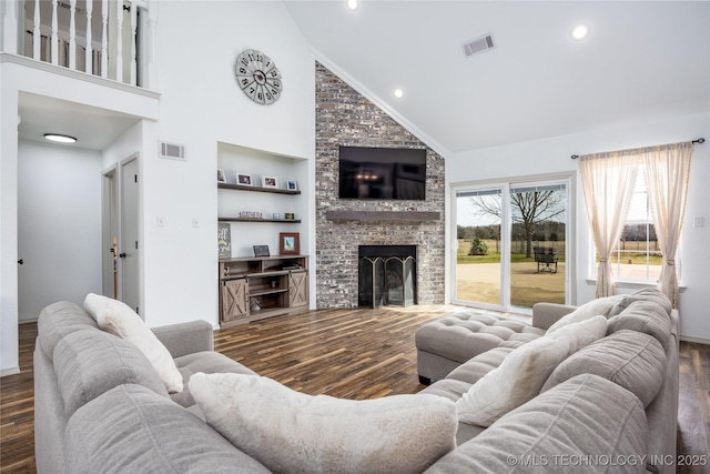 1522 Burney Cemetary, Calera, OK 74730 - living area featuring visible vents, recessed lighting, a brick fireplace, and wood finished floors