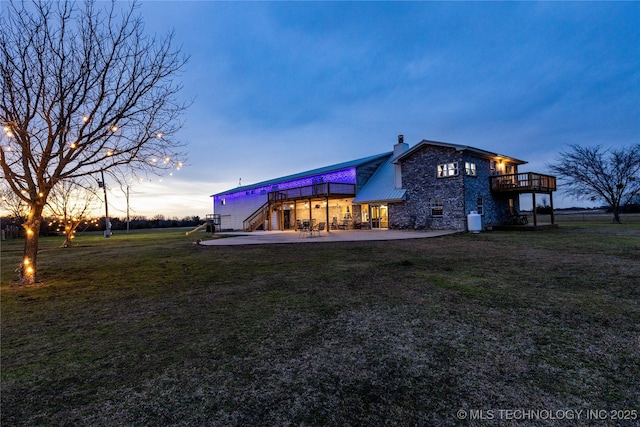 1522 Burney Cemetary, Calera, OK 74730 - back of property with a chimney, metal roof, a yard, and a patio