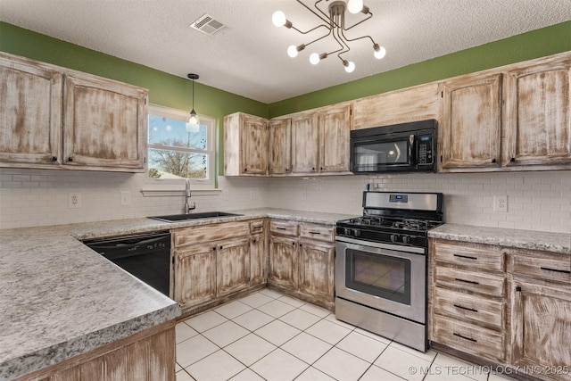 kitchen with visible vents, light tile patterned flooring, a sink, black appliances, and light countertops