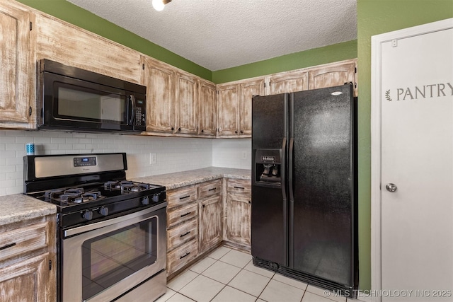 kitchen with tasteful backsplash, black appliances, and light countertops