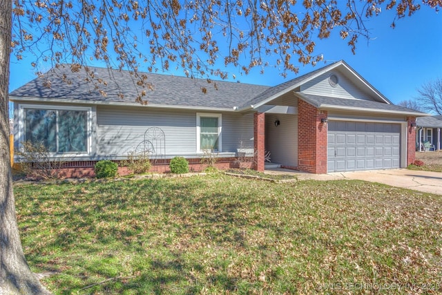 single story home featuring brick siding, a shingled roof, a front yard, driveway, and an attached garage