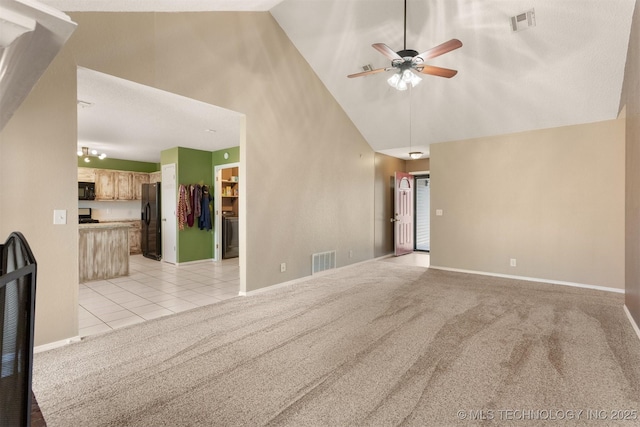 unfurnished living room with light carpet, visible vents, high vaulted ceiling, and light tile patterned flooring