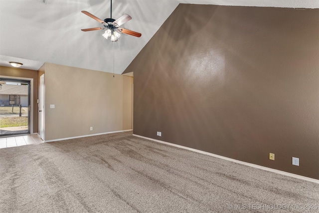 empty room with high vaulted ceiling, baseboards, ceiling fan, and carpet floors