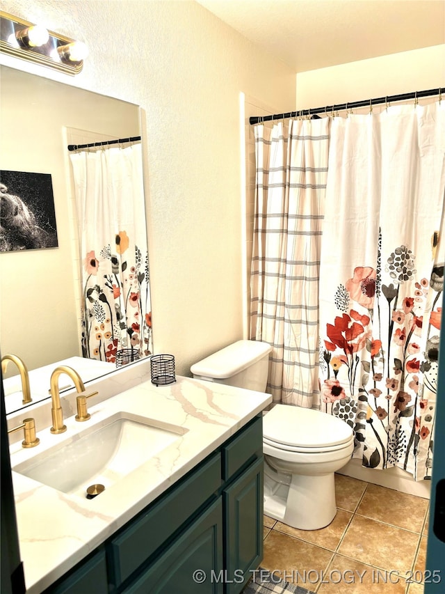 bathroom featuring tile patterned flooring, a shower with curtain, toilet, and vanity