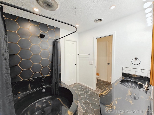 full bath with recessed lighting, visible vents, toilet, and a textured ceiling