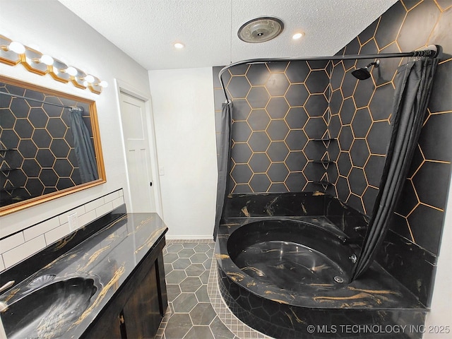 full bathroom with curtained shower, vanity, a bath, tile patterned floors, and a textured ceiling