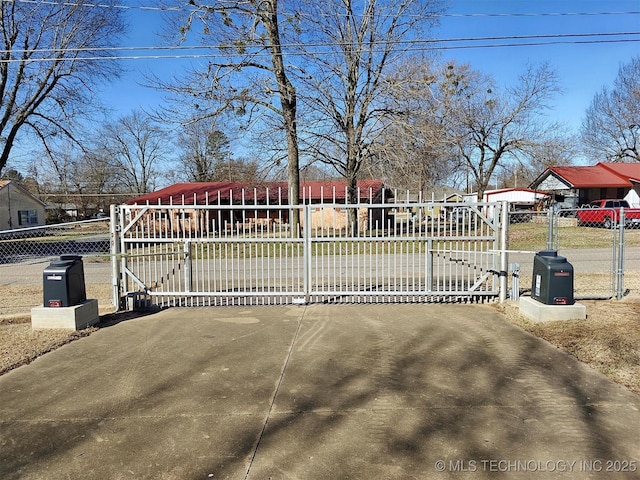 view of gate with fence