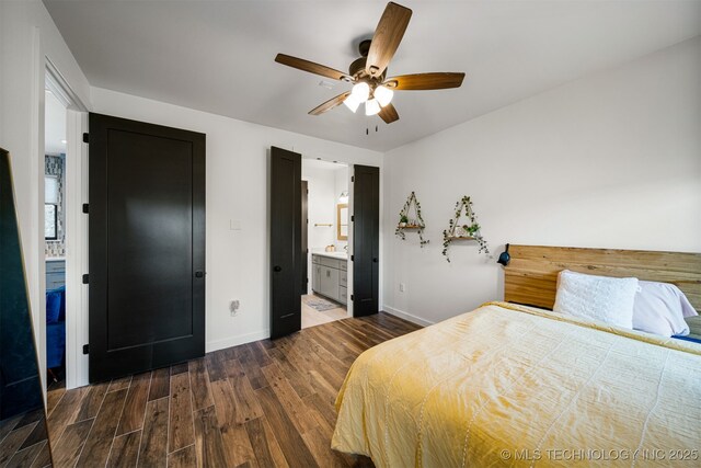 7701 S 21st St, Broken Arrow, OK 74011 - bedroom featuring baseboards, ceiling fan, ensuite bath, and wood finished floors