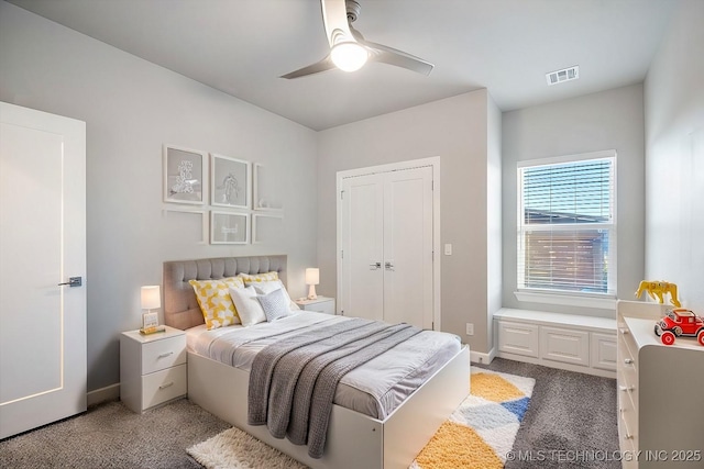 bedroom featuring a ceiling fan, baseboards, visible vents, and carpet floors