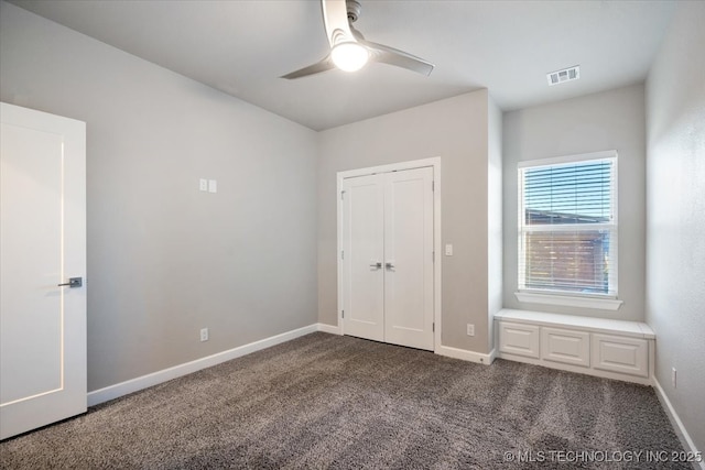 unfurnished bedroom with visible vents, a ceiling fan, a closet, carpet, and baseboards