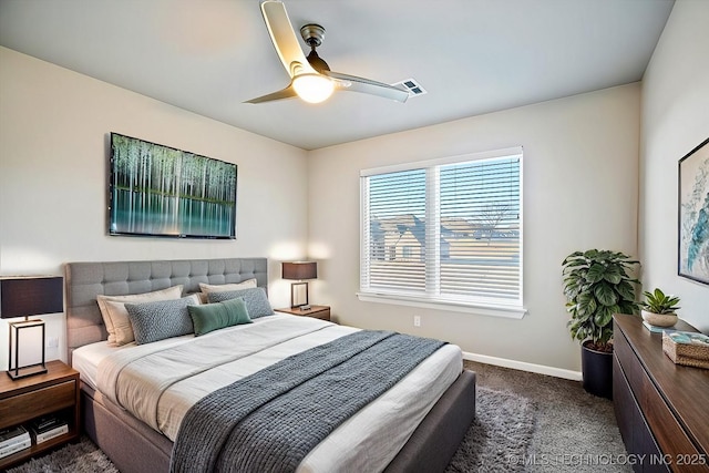 carpeted bedroom featuring baseboards and a ceiling fan