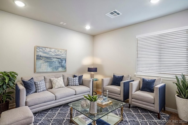 living room featuring visible vents, recessed lighting, baseboards, and carpet floors