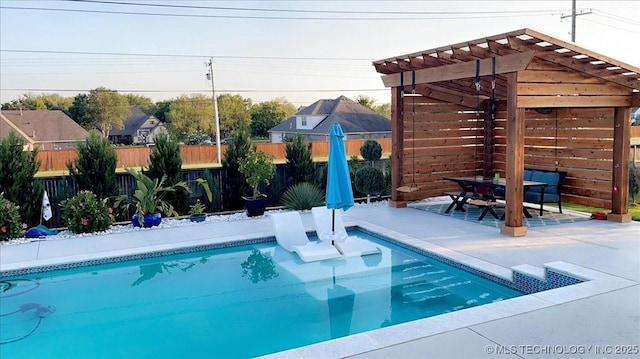 view of swimming pool with outdoor dining space, a fenced in pool, fence, a pergola, and a patio area