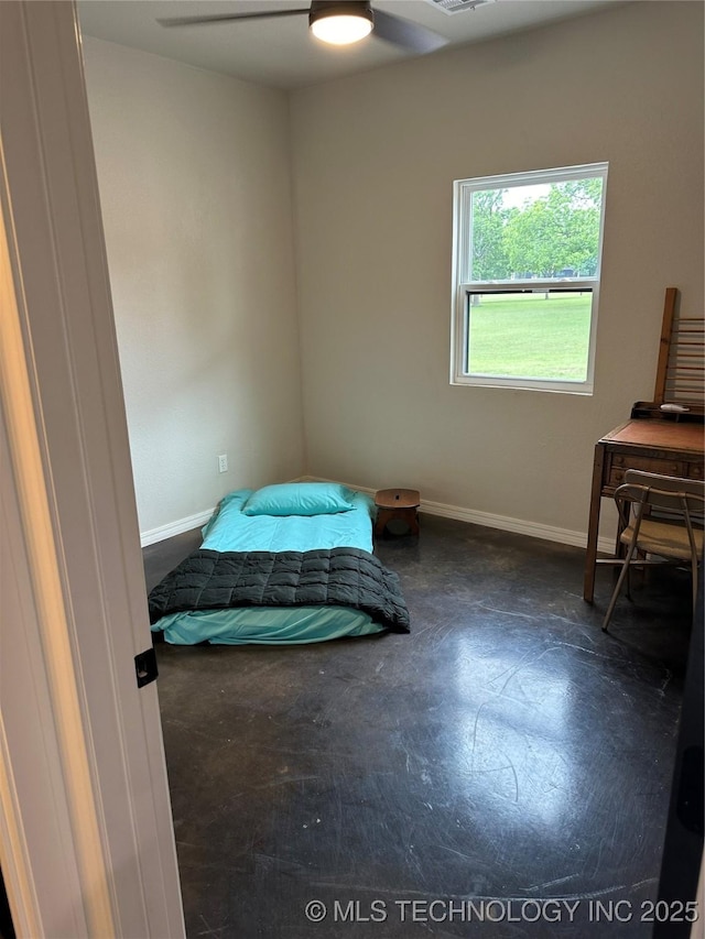 bedroom featuring baseboards and a ceiling fan