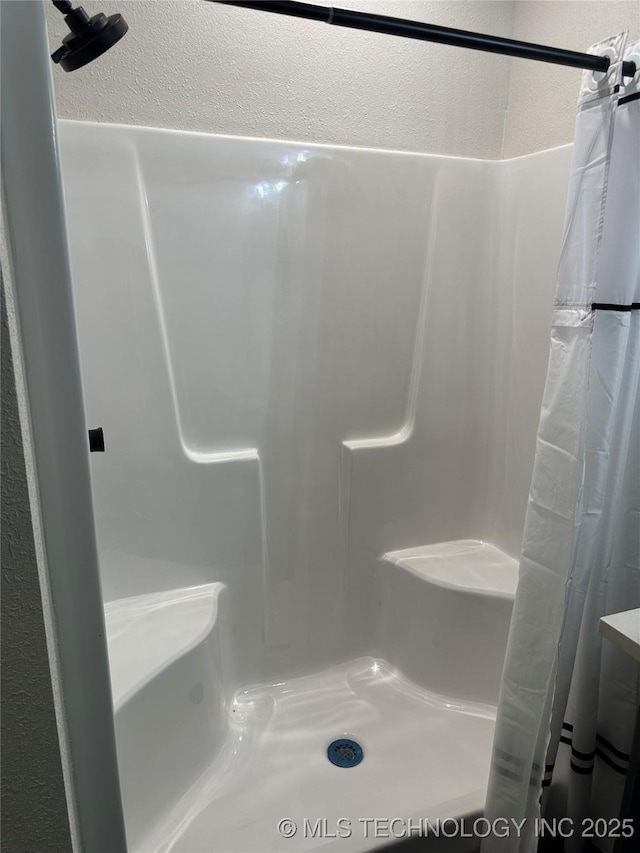 bathroom with curtained shower