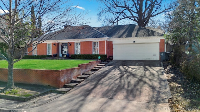 ranch-style house featuring concrete driveway, an attached garage, brick siding, and a front lawn