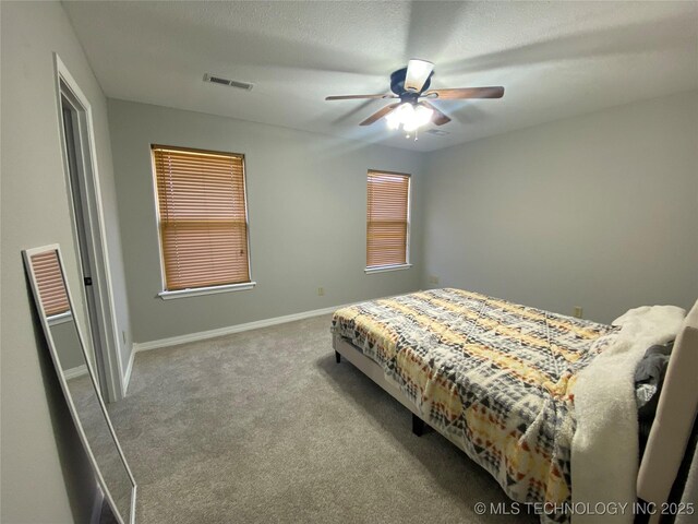 191 W Senior St, Colcord, OK 74338 - bedroom with carpet floors, a ceiling fan, and baseboards