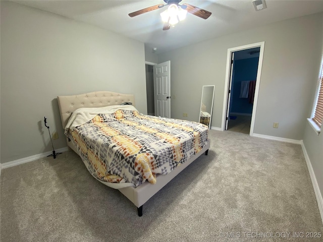 carpeted bedroom with visible vents, baseboards, and ceiling fan