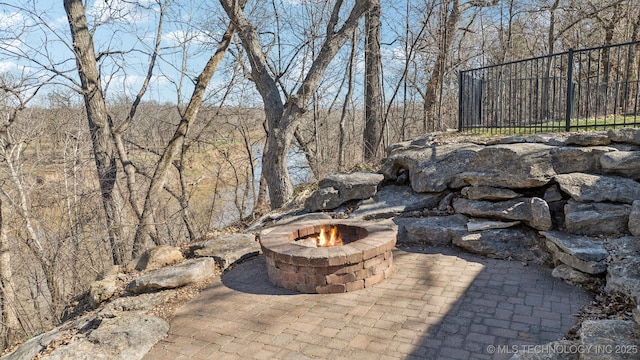 view of patio with an outdoor fire pit