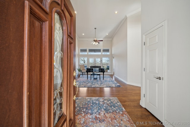 foyer featuring ornamental molding, dark wood finished floors, recessed lighting, baseboards, and ceiling fan