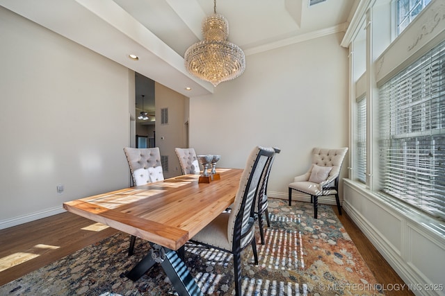 dining space featuring a wealth of natural light, baseboards, and wood finished floors