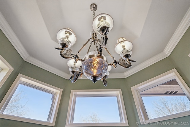 interior details featuring a chandelier, visible vents, and crown molding