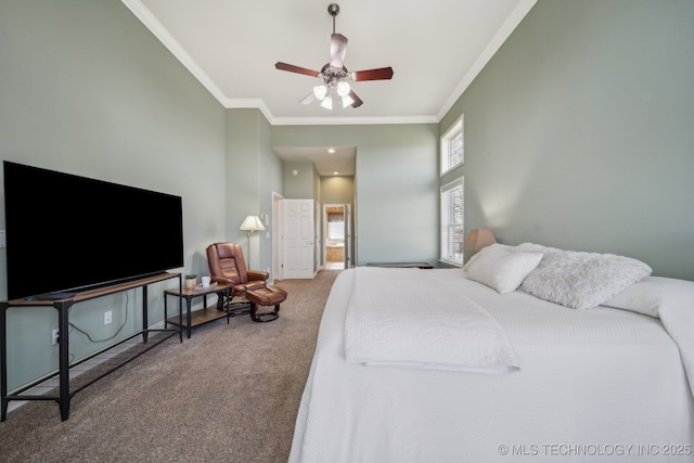 bedroom with carpet, baseboards, a high ceiling, ceiling fan, and crown molding