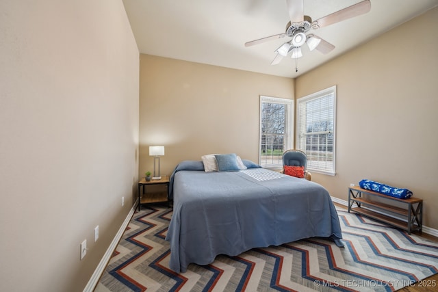 bedroom with baseboards and ceiling fan