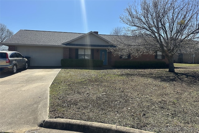 single story home with brick siding, driveway, a shingled roof, and a garage