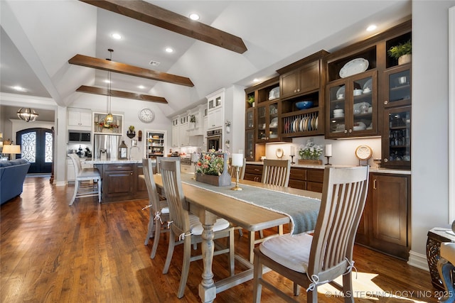 dining space featuring arched walkways, recessed lighting, lofted ceiling with beams, and dark wood-type flooring