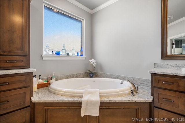 full bath with visible vents, a garden tub, ornamental molding, and vanity