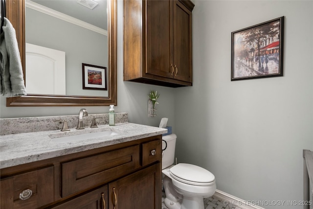 bathroom featuring visible vents, toilet, crown molding, baseboards, and vanity