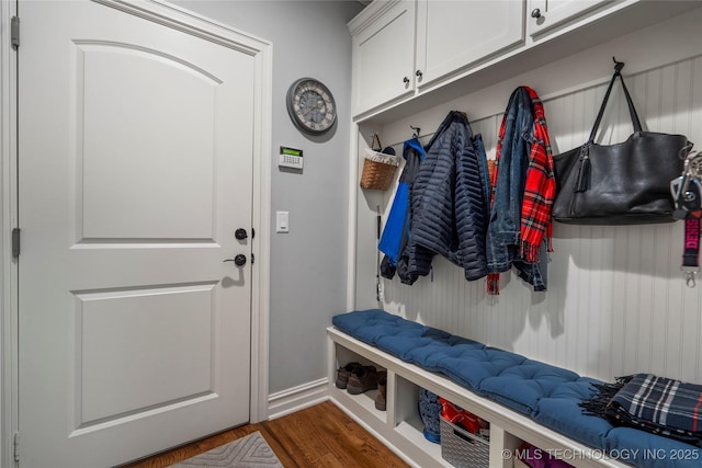 mudroom with dark wood-style flooring