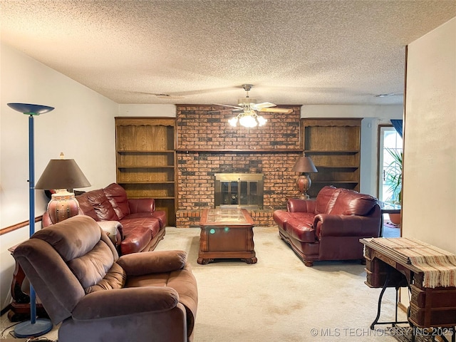 carpeted living area featuring a ceiling fan, a fireplace, and a textured ceiling