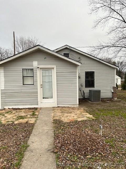 back of house featuring central AC