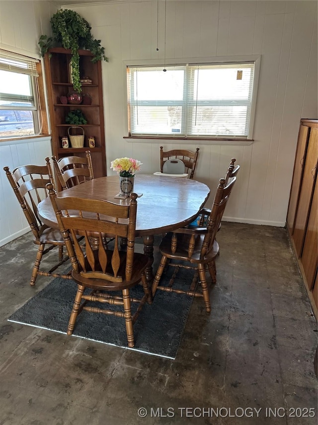 dining area featuring baseboards