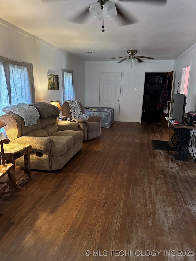 living room with dark wood-style floors and a ceiling fan