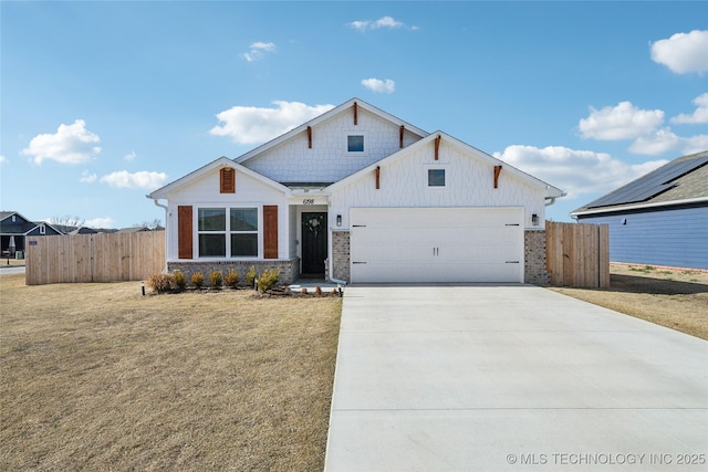 view of front of property featuring an attached garage, fence, board and batten siding, and driveway