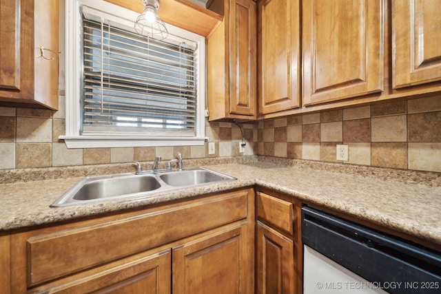 kitchen featuring light countertops, decorative backsplash, white dishwasher, brown cabinetry, and a sink