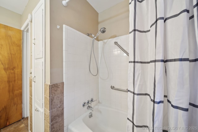 bathroom with shower / tub combo with curtain