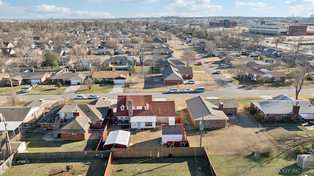 birds eye view of property with a residential view