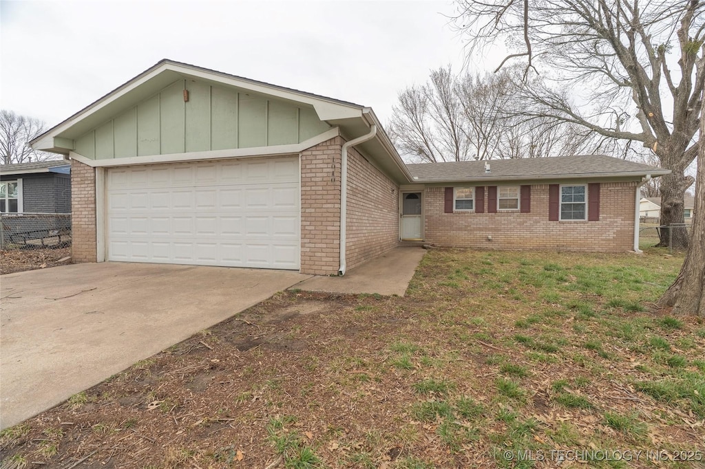 ranch-style home featuring fence, driveway, an attached garage, brick siding, and board and batten siding