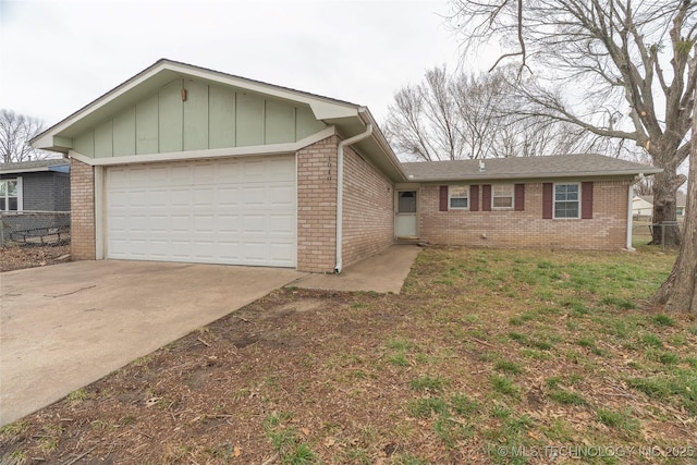 ranch-style home featuring fence, driveway, an attached garage, brick siding, and board and batten siding