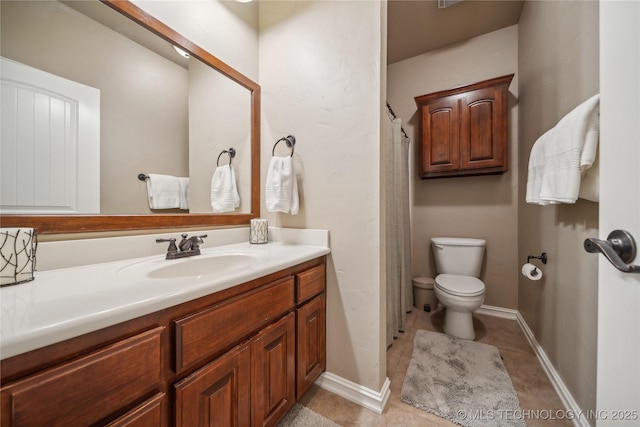 bathroom with vanity, a shower with shower curtain, baseboards, tile patterned flooring, and toilet