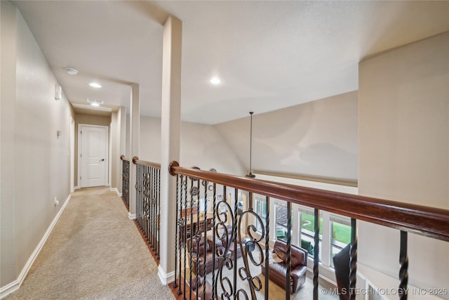 hallway featuring recessed lighting, carpet, and baseboards