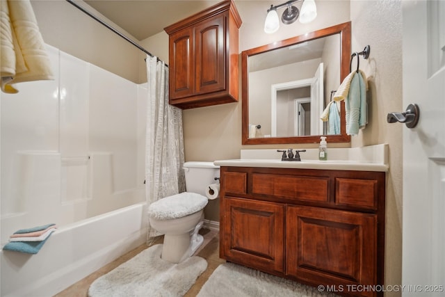 bathroom with toilet, vanity, and shower / bath combination with curtain