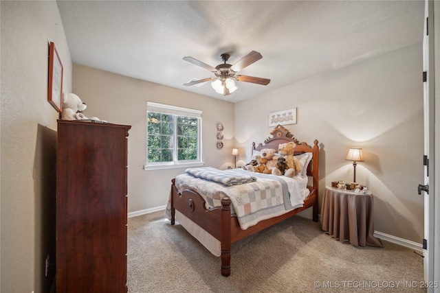 bedroom featuring baseboards, carpet floors, and ceiling fan